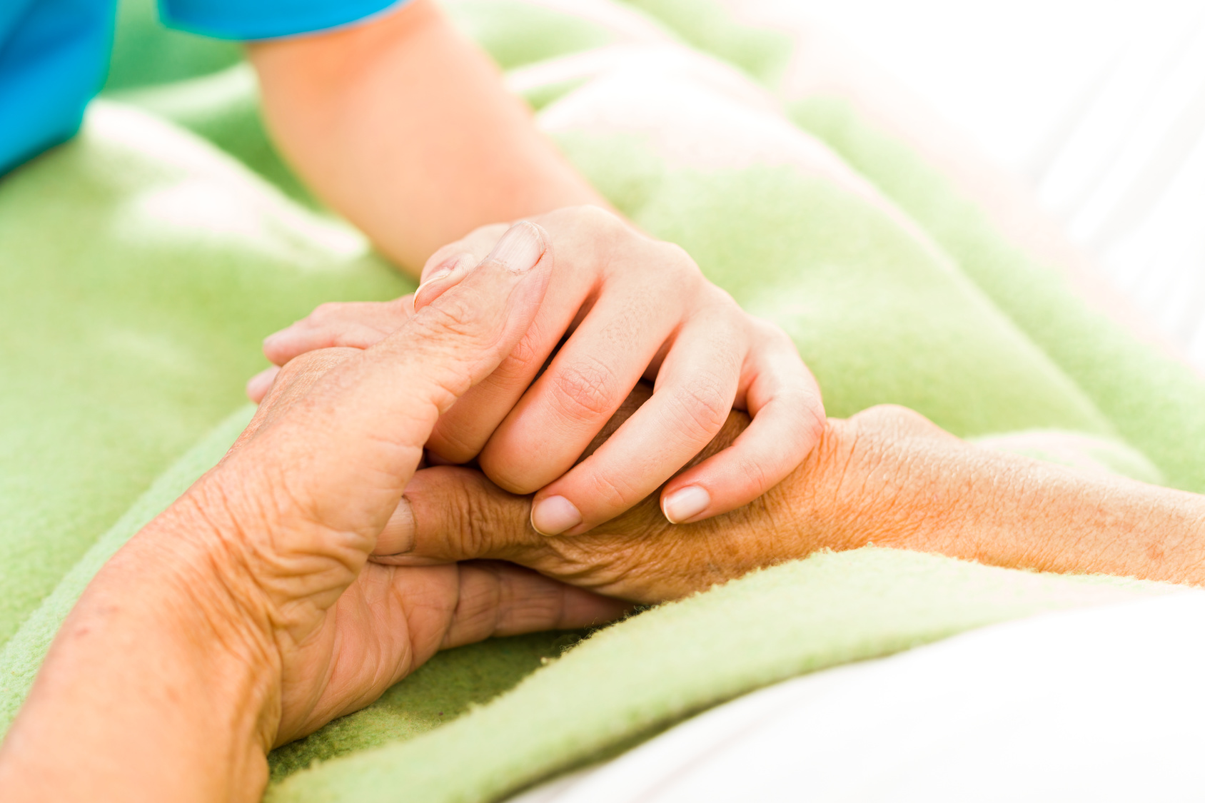 Health Care Nurse Caring For Elderly Concept - Holding Hands.
